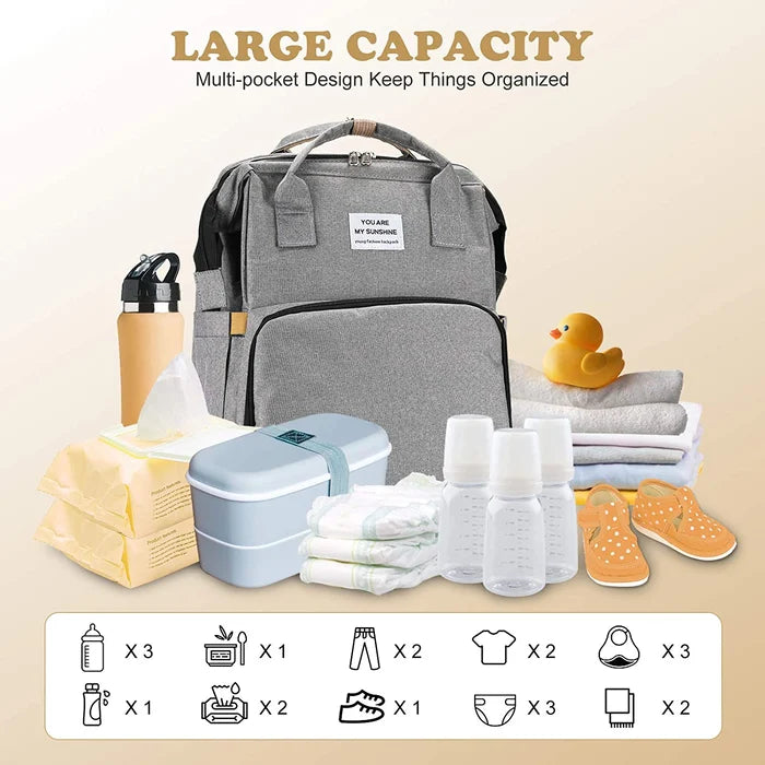 Versatile diaper bag with a built-in changing station for easy diaper changes